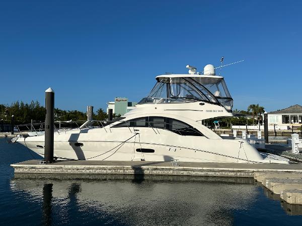 Sea Ray 47 Sedan Bridge 2008 Sea Ray 47 Sedan Bridge yacht docked at marina under clear blue sky.