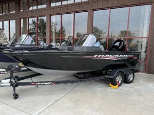 Tracker Pro Guide V-175 WT 2025 Tracker Pro Guide V-175 WT boat on trailer, parked outside a building.