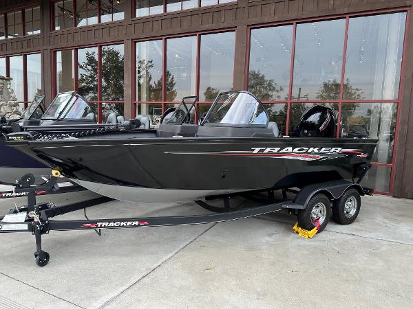 Tracker Pro Guide V-175 WT 2025 Tracker Pro Guide V-175 WT boat on trailer, parked outside a building.