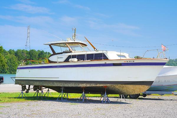 Chris-Craft Roamer 36 1962 Chris-Craft Roamer 36 boat on stands, side view, outdoors.