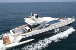 Azimut 86S 2005 Azimut 86S yacht cruising on open sea with Italian flag.