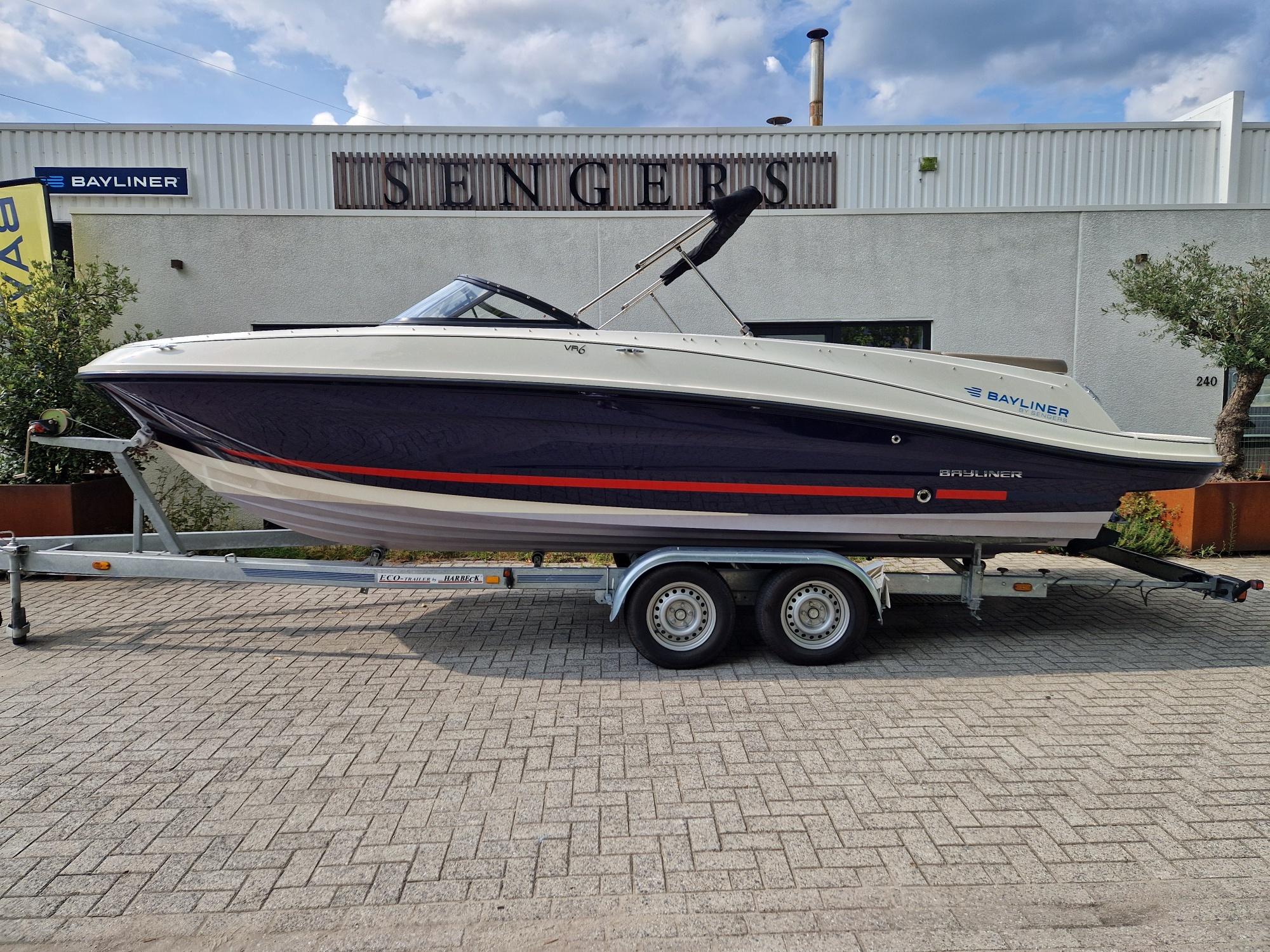 Bayliner VR6 Bowrider 2017 Bayliner VR6 Bowrider on trailer, parked outside dealership.