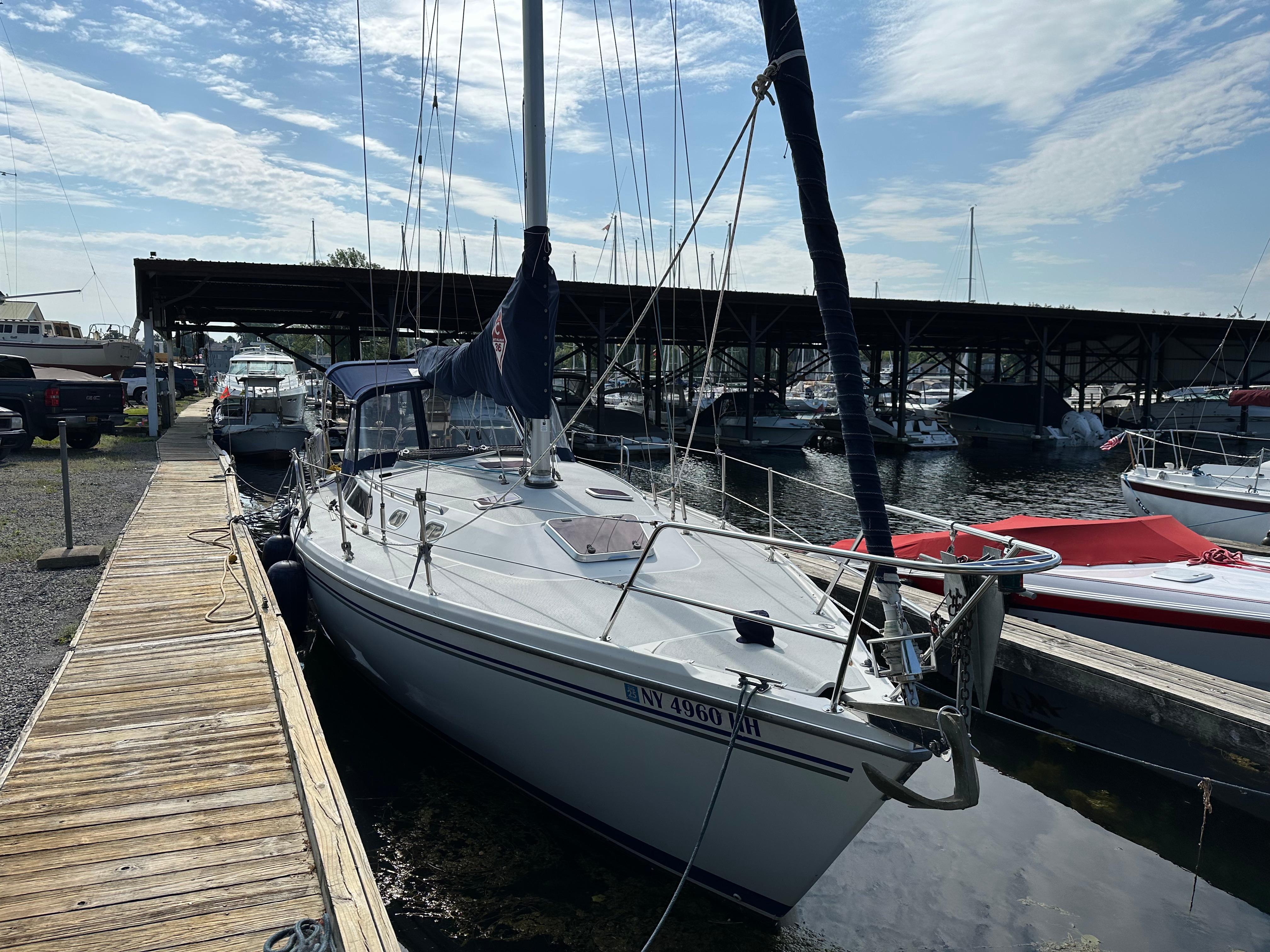 Catalina 36 MkII 2005 Catalina 36 MkII sailboat docked at marina under clear sky.
