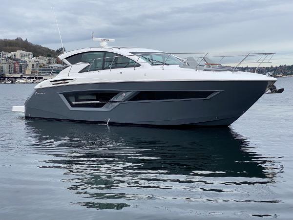 Cruisers Yachts 46 Cantius 2023 Cruisers Yachts 46 Cantius luxury boat on calm water, side view.