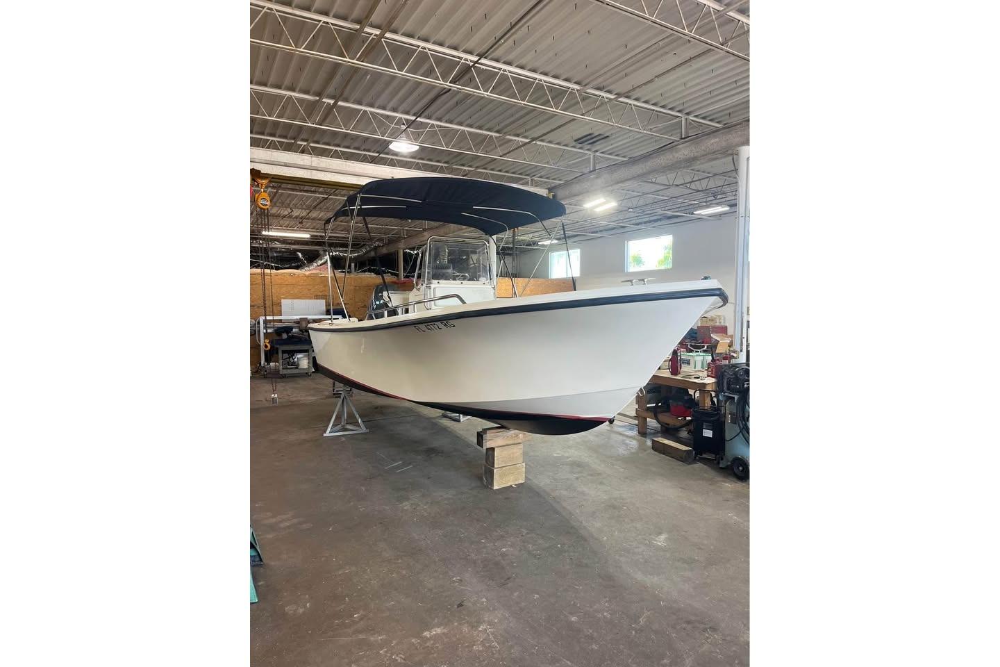 Parker 2100 Special Edition 2009 Parker 2100 Special Edition boat in a warehouse setting.