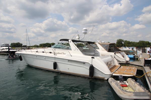 Sea Ray 500 Sundancer 1998 Sea Ray 500 Sundancer yacht docked at marina under cloudy sky.