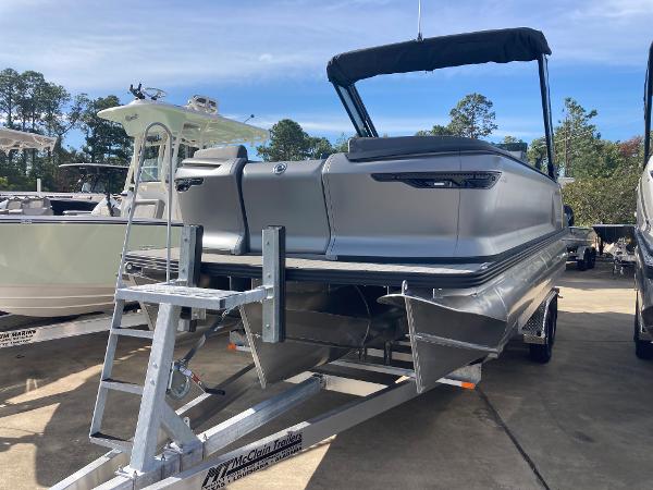 Manitou Explorer 24 switchback 24 MAX Trifold Stealth 2024 Manitou Explorer 24 Switchback 24 MAX Trifold Stealth pontoon boat on trailer.