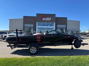 MasterCraft 197 Tt 2008 MasterCraft 197TT boat on trailer outside Action Water Sports dealership.