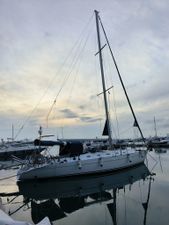 Custom Atlantic 44 Sailboat "Atlantic 44" from 1994 docked at marina during sunset.