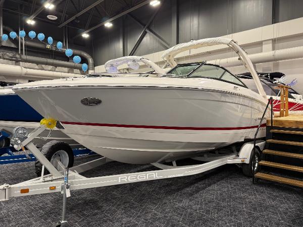 Regal LS4 2025 Regal LS4 boat displayed indoors on a trailer.
