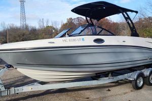 Bayliner VR6 Bowrider OB 2022 Bayliner VR6 Bowrider OB on trailer, parked outdoors with trees in background.