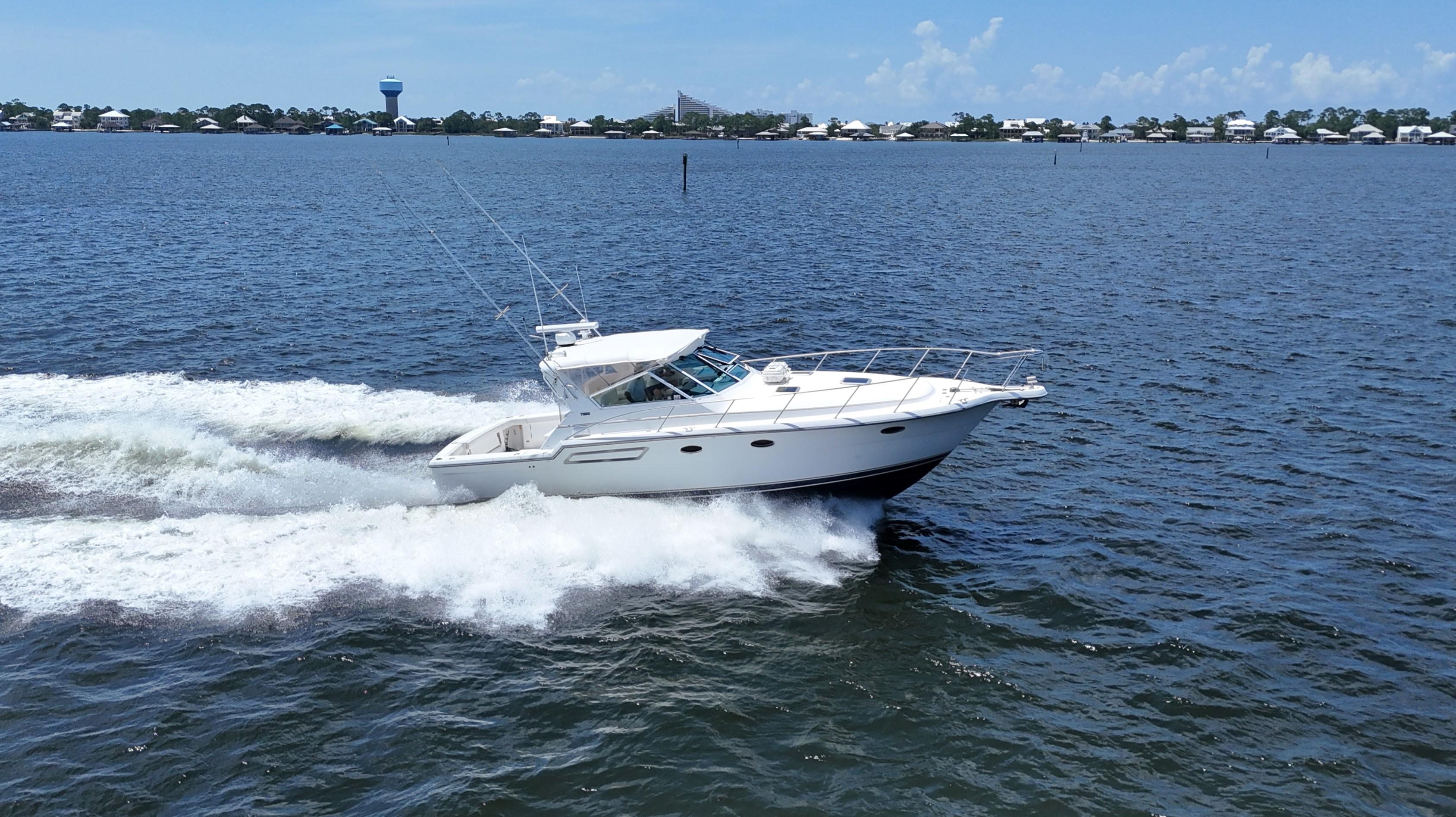 Tiara Yachts 3700 Open 2000 Tiara Yachts 3700 Open cruising on a sunny day, creating waves in the water.
