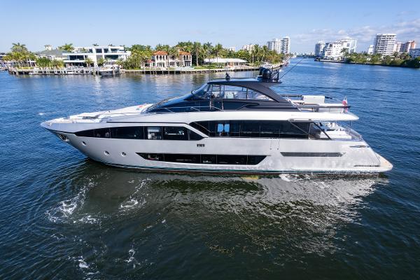 Riva 90' Argo 2023 Riva 90' Argo yacht cruising on a sunny day in a coastal waterway.