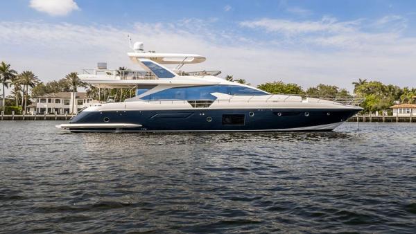 Azimut Fly 72 2016 Azimut Fly 72 yacht on calm water, with luxury homes in the background.
