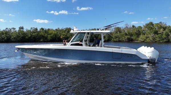 Boston Whaler 380 Outrage 2021 Boston Whaler 380 Outrage cruising on a sunny day with clear skies.