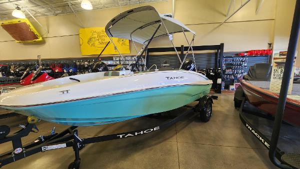 Tahoe T16 2025 Tahoe T16 boat displayed indoors on a trailer, featuring a sleek design and canopy.