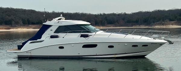 Sea Ray 450 Sundancer 2010 Sea Ray 450 Sundancer yacht on calm water, side view.