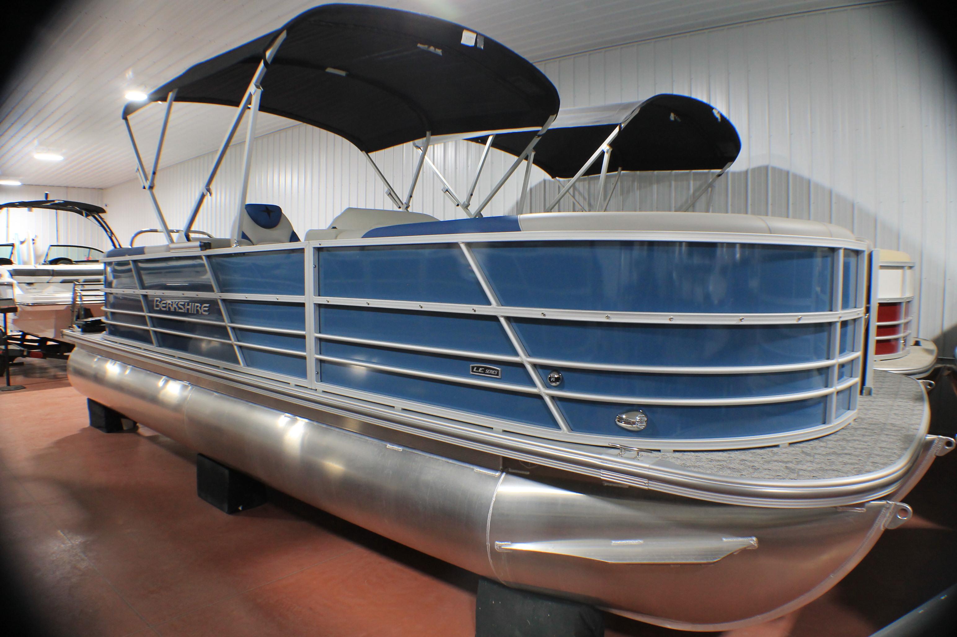 Berkshire 24 RFX LE 2025 Berkshire 24 RFX LE pontoon boat with blue exterior in showroom.