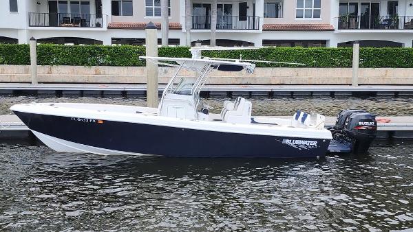 Bluewater 2550 2015 Bluewater 2550 boat docked by waterfront homes.