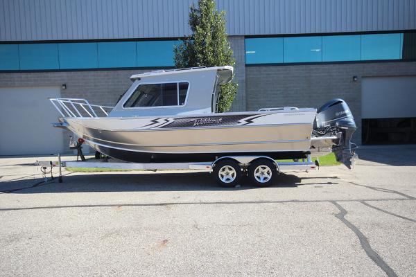 Weldcraft 220 Ocean King 250XB 2026 Weldcraft 220 Ocean King 250XB boat on trailer, parked outdoors.