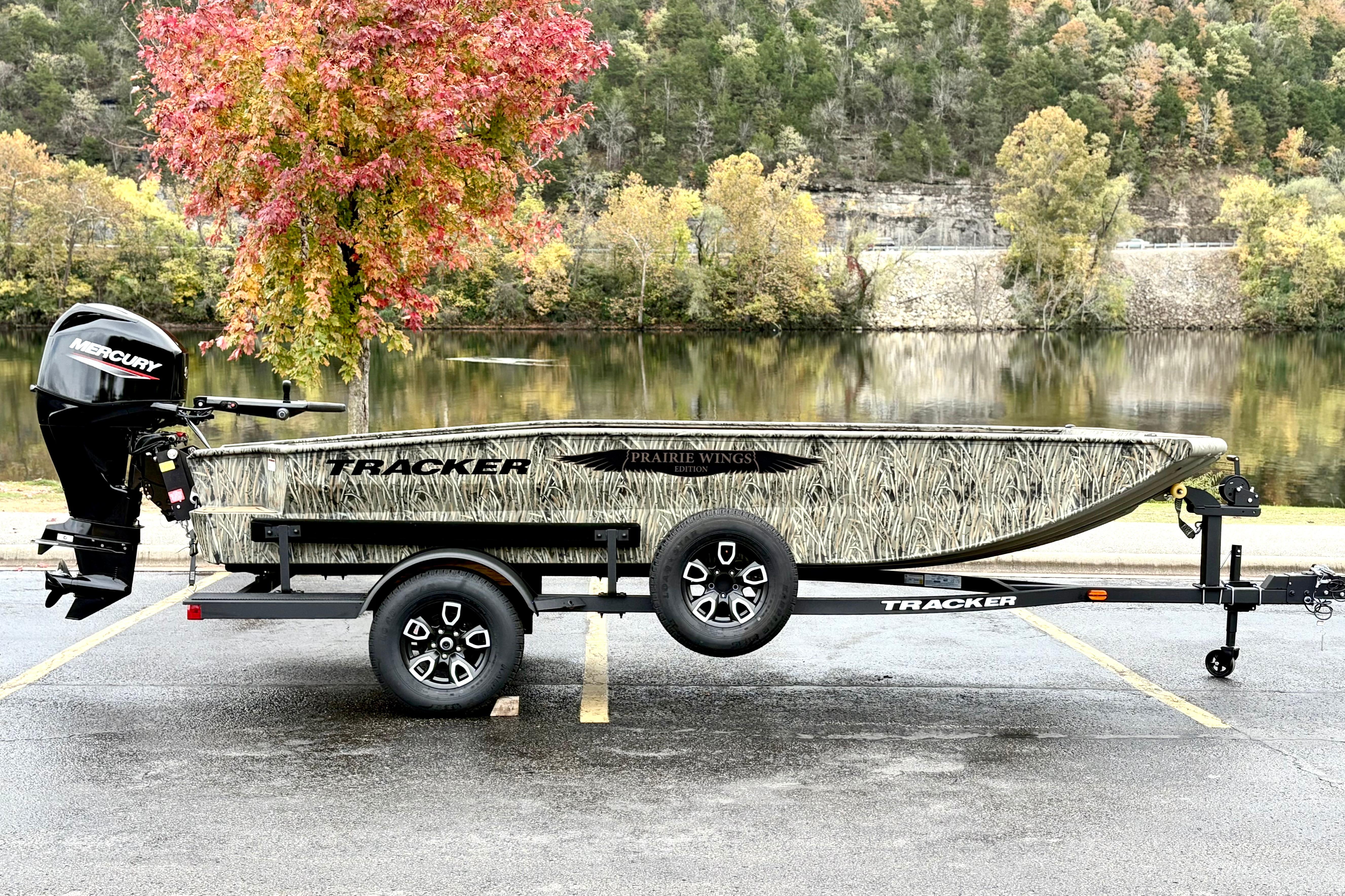 Tracker Grizzly 1650 T Prairie Wings Edition 2026 Tracker Grizzly 1650 T Prairie Wings Edition boat on trailer by scenic lake.