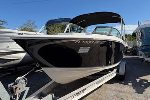 NauticStar 2302 Legacy Dual Console 2019 NauticStar 2302 Legacy Dual Console boat on trailer, black hull, sunny day.