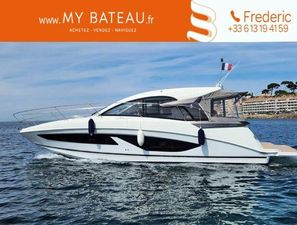 Beneteau Gran Turismo 36 2022 Beneteau Gran Turismo 36 yacht cruising on open water, side view.