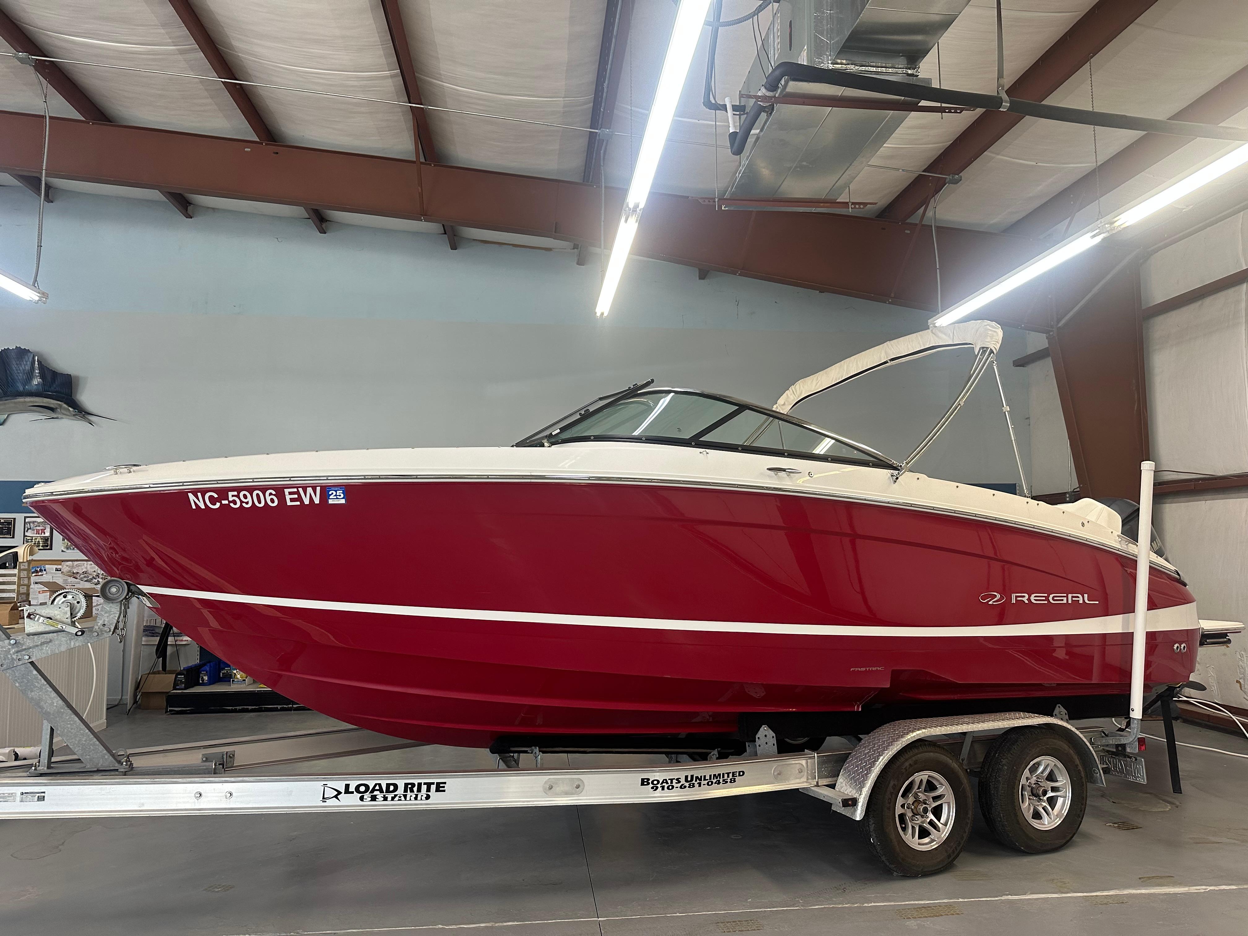 Regal LX4 2022 Regal LX4 boat in a garage on a trailer.