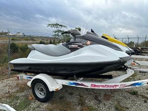 Yamaha WaveRunner VX 2014 Yamaha WaveRunner VX on trailer, parked outdoors, cloudy sky background.