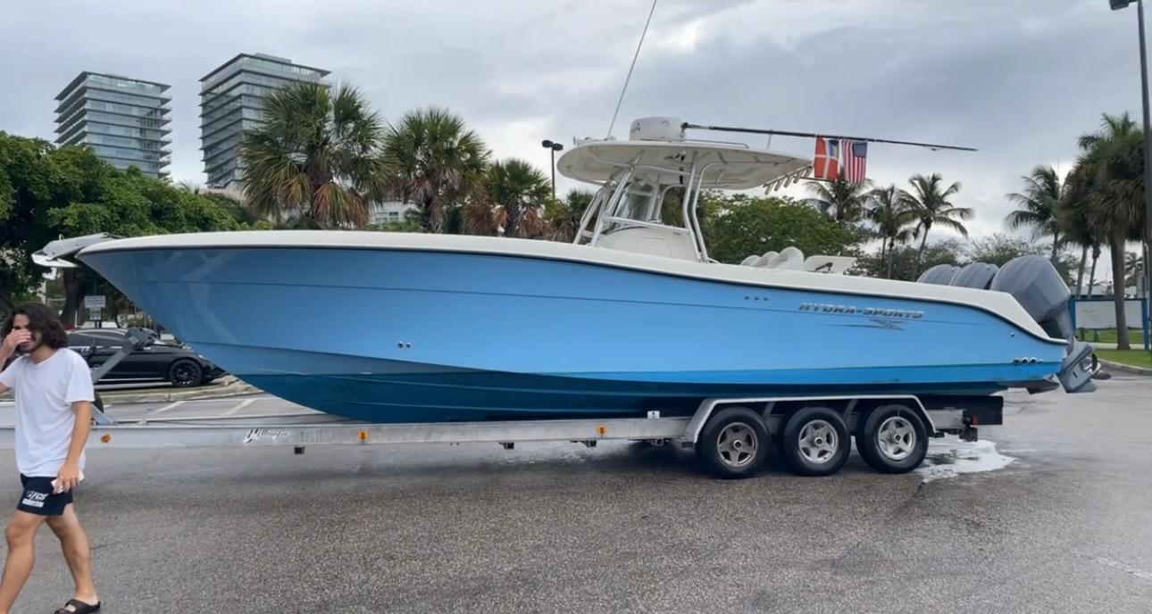 Hydra-Sports Vector 3300 CC 2007 Hydra-Sports Vector 3300 CC boat on trailer, parked near palm trees and buildings.