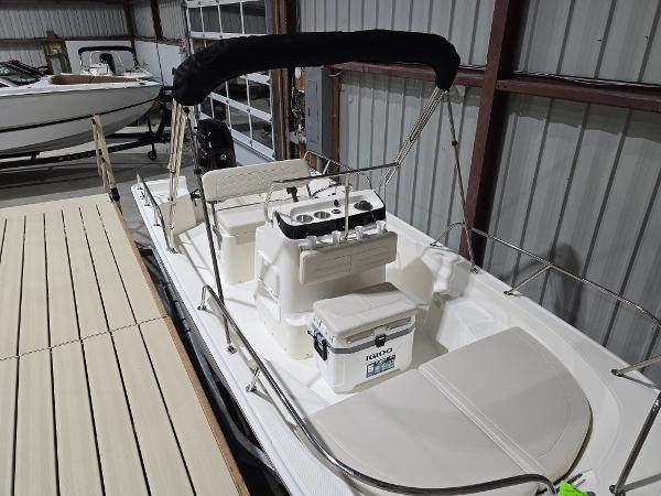 Boston Whaler 150 Montauk 2025 Boston Whaler 150 Montauk boat in storage, featuring a sleek white design.