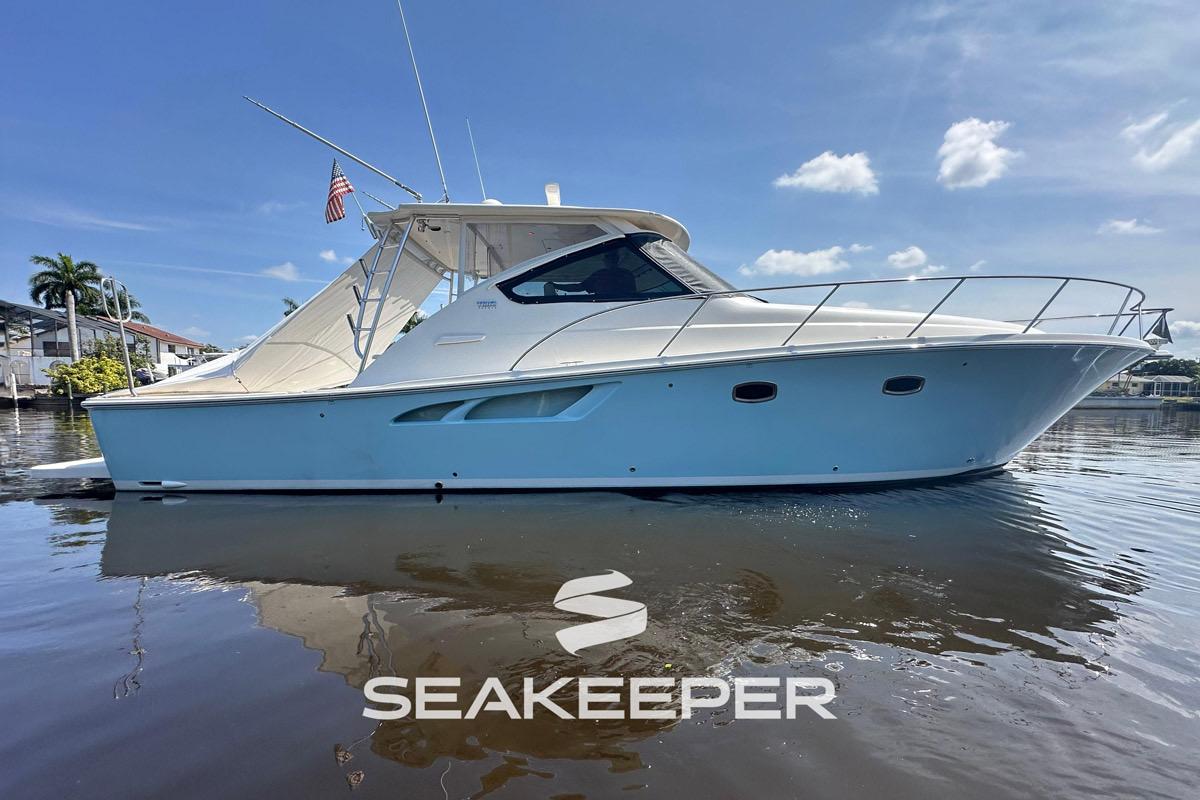 Tiara Yachts 4300 Open 2018 Tiara Yachts 4300 Open boat on calm water, featuring sleek design and Seakeeper logo.
