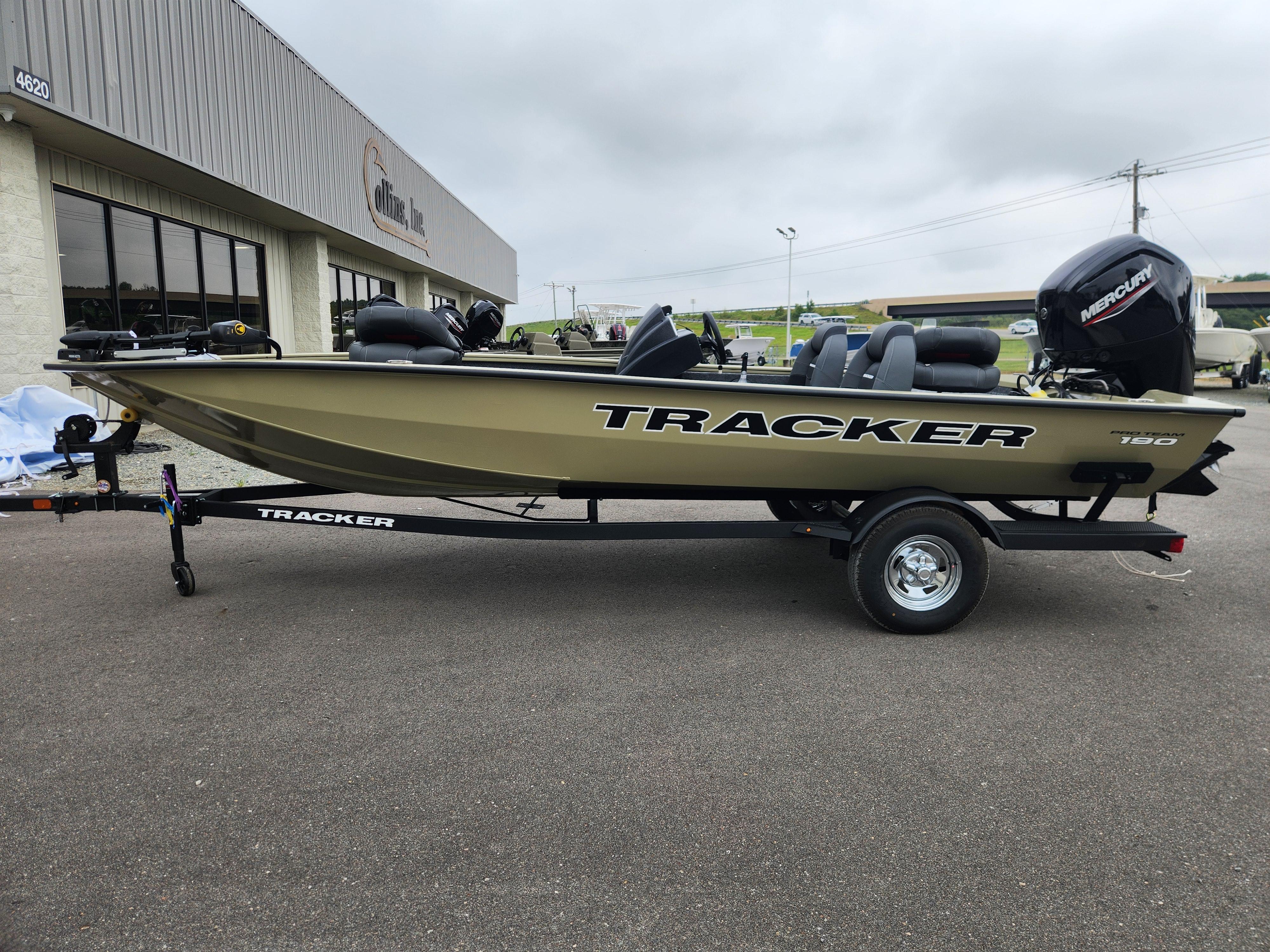 Tracker Pro Team 190 2026 Tracker Pro Team 190 boat on trailer, parked outside a building.