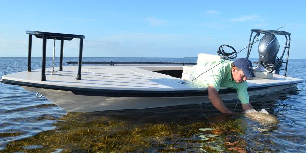 Maverick 17 HPX-S 2024 Maverick 17 HPX-S boat in shallow water with a man fishing.