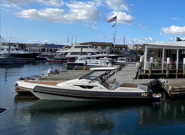 Nuova Jolly Prince 33 Sport Cabin Nuova Jolly Prince 33 SPORT CABIN 2025 docked at a marina under a blue sky.