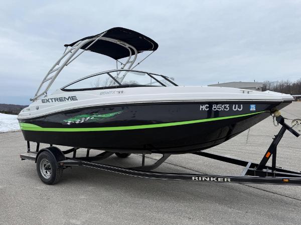 Rinker 20 MTX 2019 Rinker 20 MTX boat on trailer, black and white with green accents.