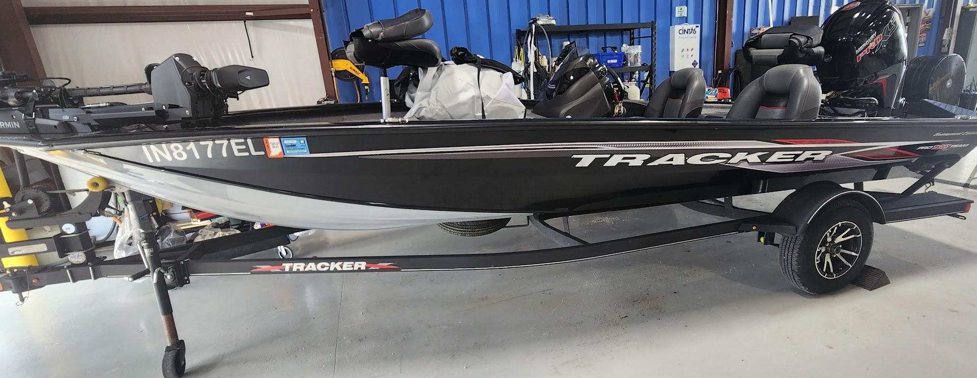 Tracker Pro Team 190 TX 2023 Tracker Pro Team 190 TX fishing boat on trailer in indoor storage.
