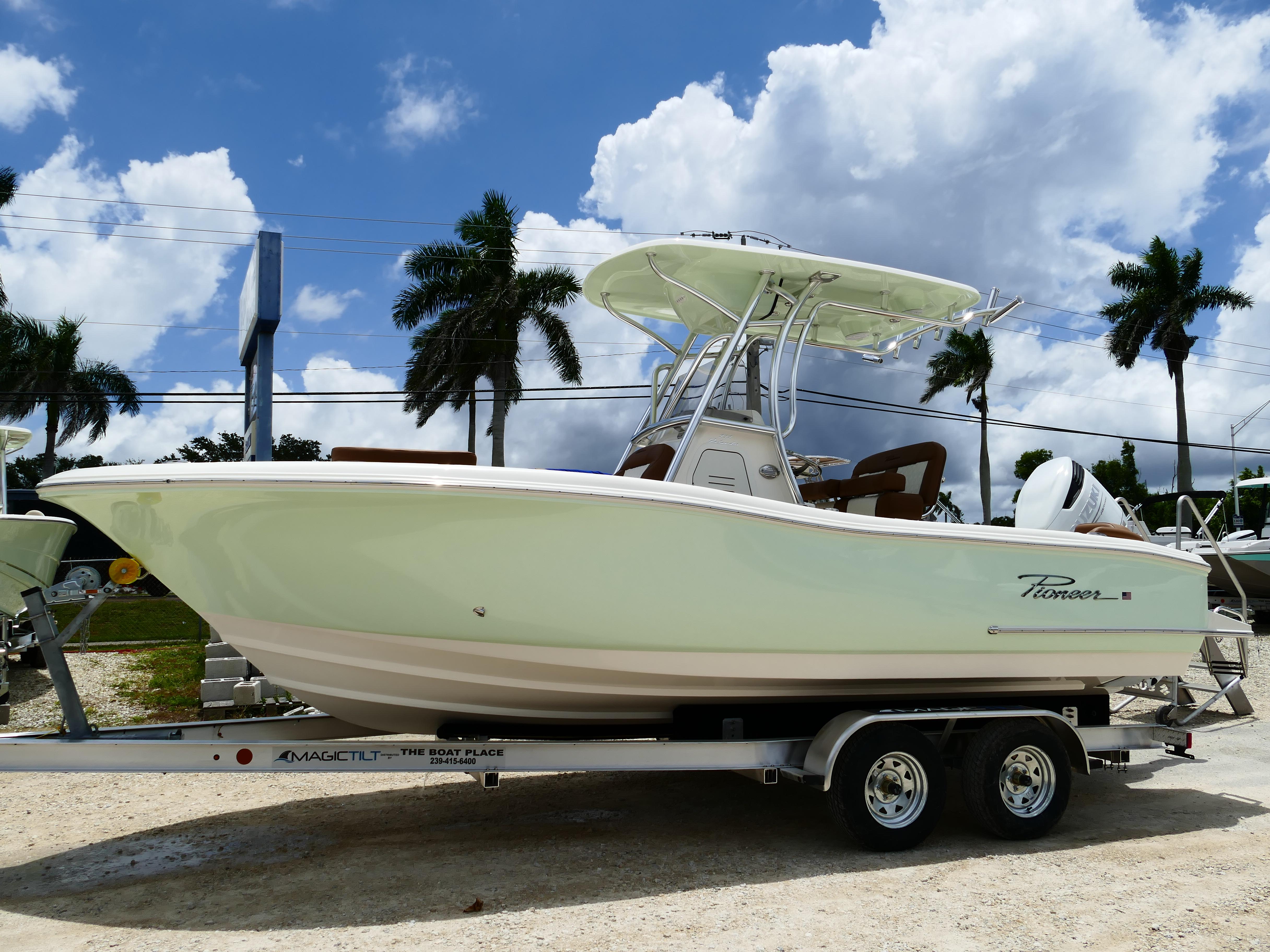 Pioneer 222 Islander 2026 Pioneer 222 Islander boat on trailer, parked outdoors under a cloudy sky.
