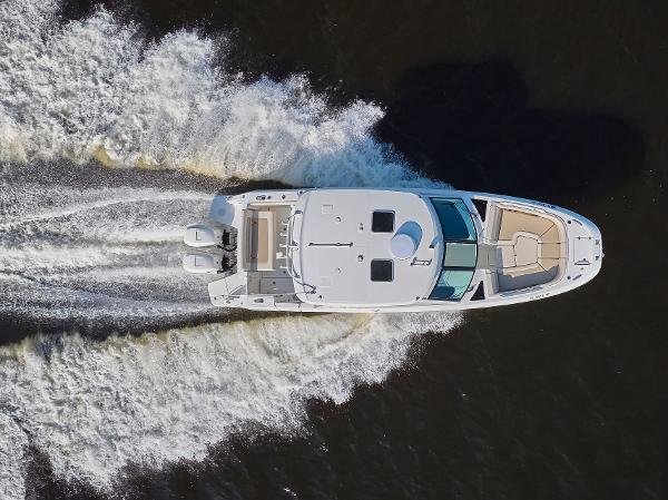 Boston Whaler 320 Vantage Aerial view of 2016 Boston Whaler 320 Vantage speeding on water.