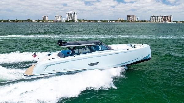 Vanquish Yachts VQ58 2022 Vanquish Yachts VQ58 cruising on open water with city skyline in background.