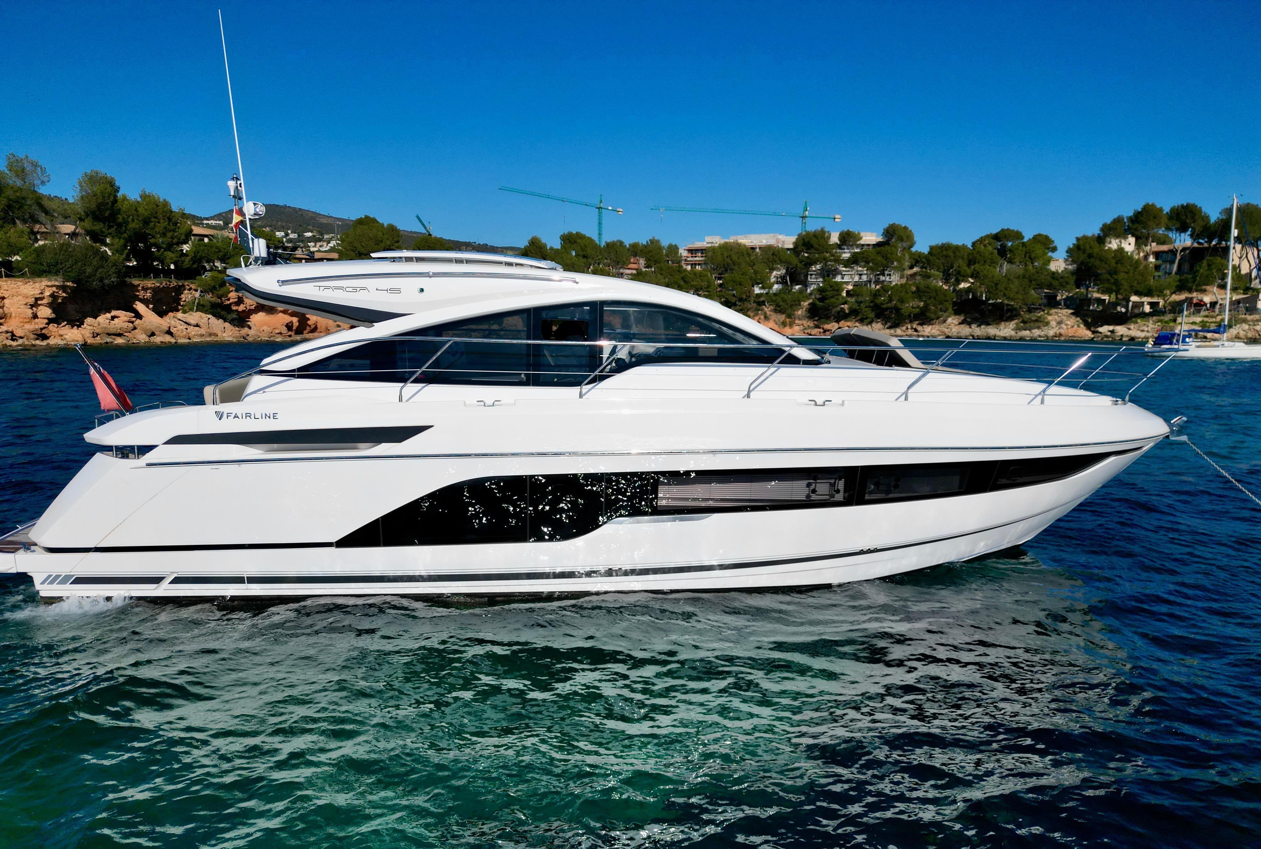 Fairline Targa 45 Open 2021 Fairline Targa 45 Open yacht on clear blue water, coastal background.