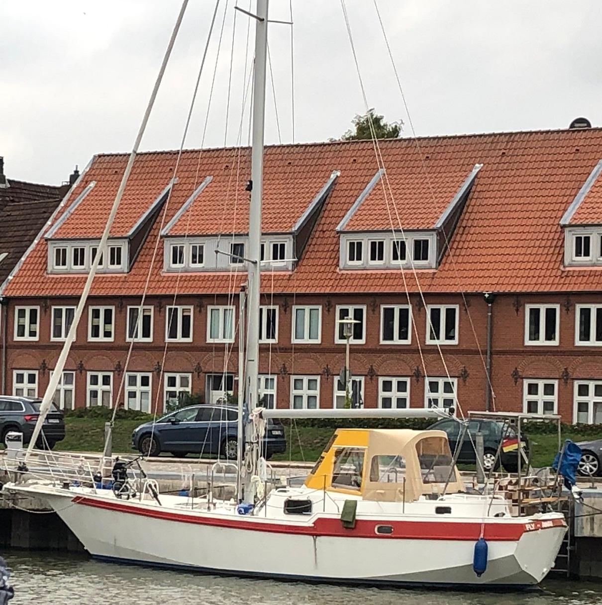 Custom Stichnoth Törn 120 Sailboat "Stichnoth Törn 120" docked near brick buildings, 2020 model.