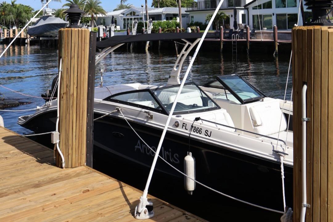 Sea Ray 270 Sundeck Outboard 2015 Sea Ray 270 Sundeck Outboard docked by waterfront homes.