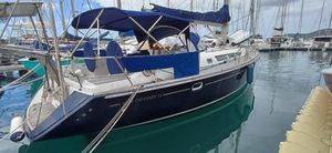Jeanneau Sun Odyssey 45 2005 Jeanneau Sun Odyssey 45 sailboat docked in marina with blue canopy.