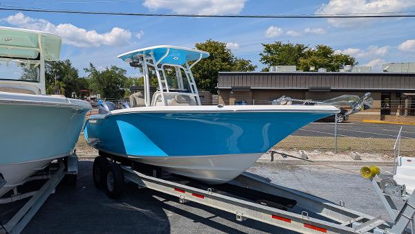 Key West 244 Center Console 2023 Key West 244 Center Console boat on trailer, vibrant blue hull, outdoor display.