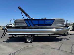 SunChaser Lucerne 20 LR DH 2026 SunChaser Lucerne 20 LR DH pontoon boat on trailer, under clear blue sky.