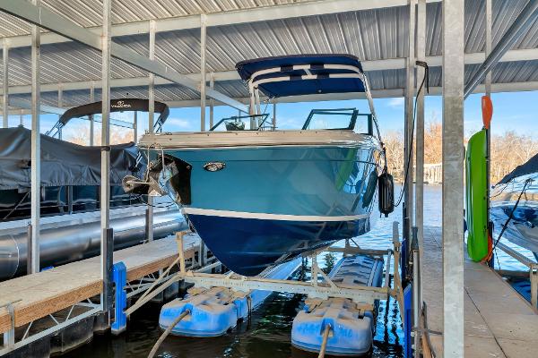 Cobalt R8 2022 Cobalt R8 boat docked in a covered marina slip.