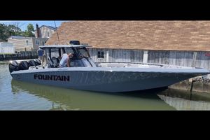 Fountain 38 SC 2024 Fountain 38 SC boat docked, featuring sleek design and powerful engines.