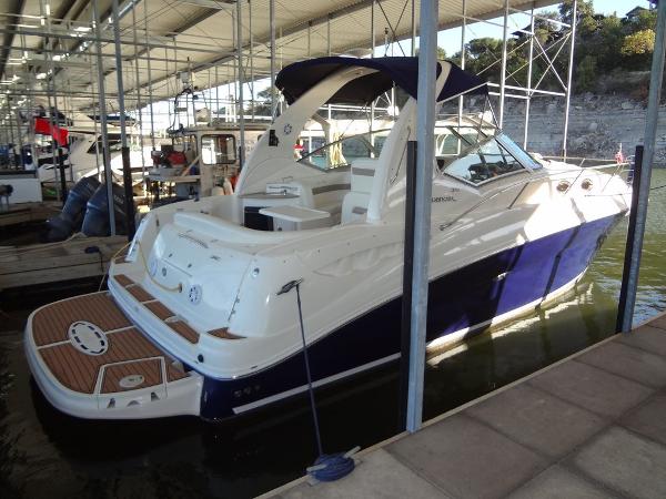 Sea Ray 320 Sundancer 2005 Sea Ray 320 Sundancer docked in a marina under a covered structure.