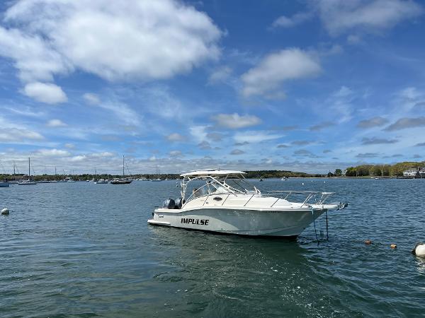Scout 262 Abaco 2012 Scout 262 Abaco boat named "Impulse" on calm water under blue sky.
